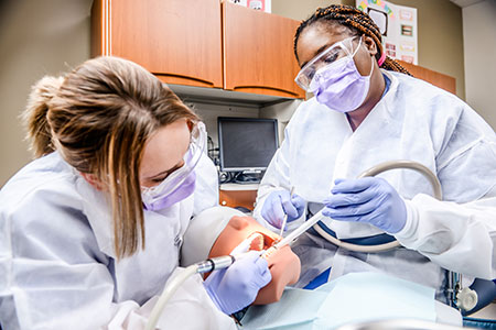 Remington College Dental Assisting Program Students Practice their Dental Assisting Skills at Remington College
